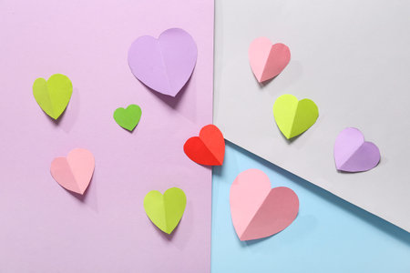 Composition with different paper hearts on color background. Valentines Day celebration