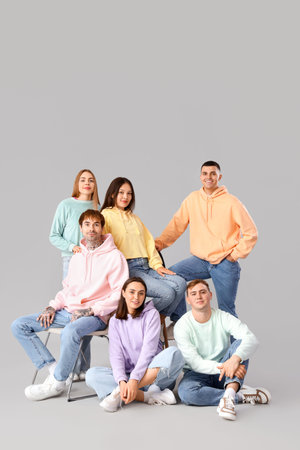 Group of young people in stylish jeans on light backgroundの写真素材