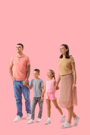 Happy family walking on pink background