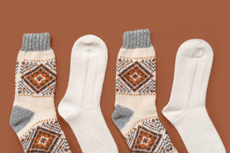 Warm socks on brown background