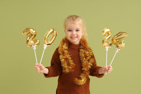 Cute little girl with tinsel and figure 2024 on green background