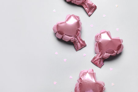 Pink heart shaped air balloons on gray backgroundの写真素材