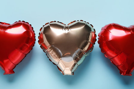Heart shaped air balloons on blue backgroundの写真素材