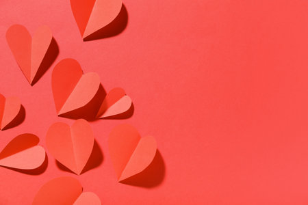 Paper hearts on red background. Valentine's Day celebrationの写真素材