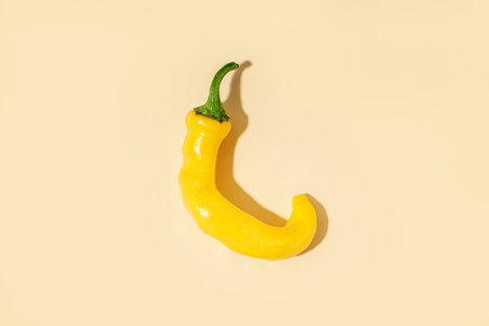 Yellow chili pepper on white backgroundの写真素材