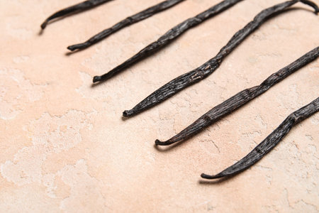 Aromatic vanilla sticks on pink background