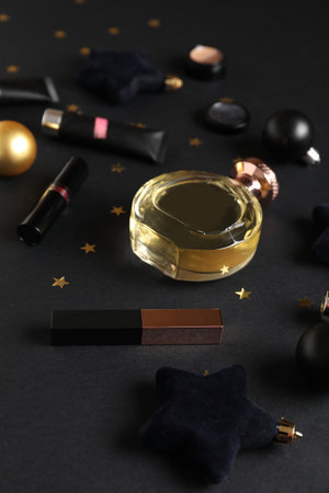 Christmas composition with cosmetics on black backgroundの写真素材