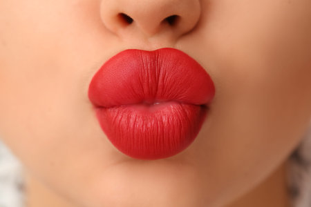 Beautiful woman with red lipstick, closeup