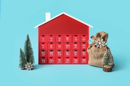 Winter advent calendar and beautiful Christmas decor on color backgroundの写真素材