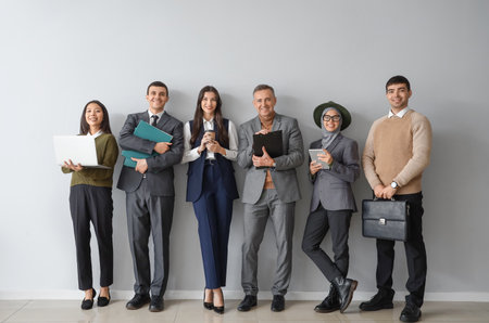Business people near light wallの写真素材