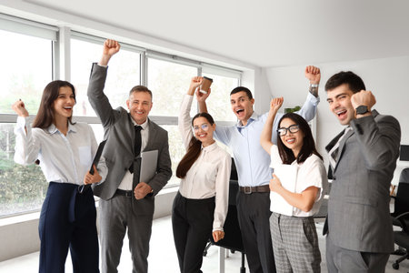 Happy business colleagues working in officeの写真素材