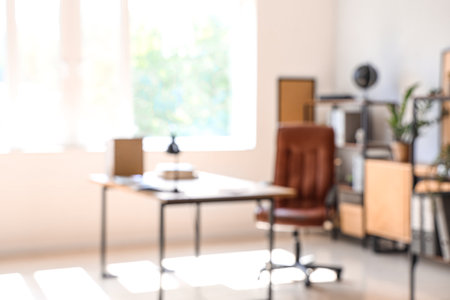 Blurred view of modern office with workplaceの写真素材