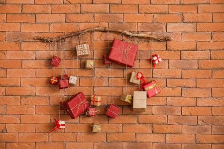 Christmas advent calendar hanging on brick wallの写真素材