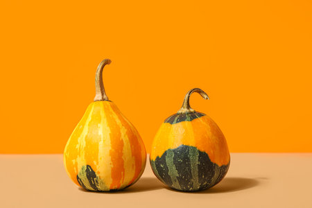 fresh pumpkins on orange background