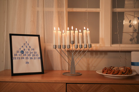 Wooden cabinet with traditional Hanukkah decorations at home, closeupの写真素材