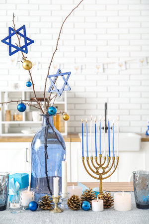 Festive table setting with Hanukkah decorations in kitchen, closeupの写真素材