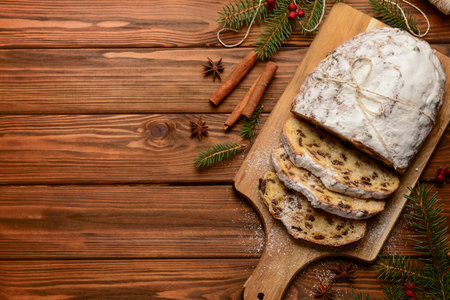 Composition with tasty Christmas stollen on wooden backgroundの写真素材