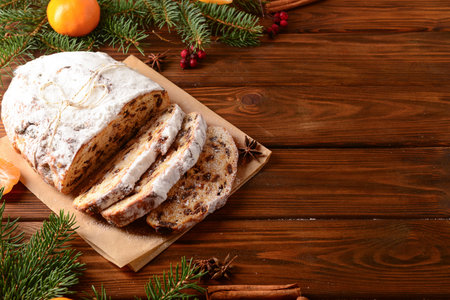 Composition with tasty Christmas stollen on wooden backgroundの写真素材
