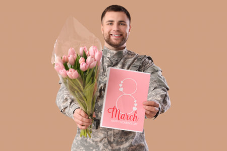 Male soldier with tulips and greeting card on brown background. International Women's Day celebrationの写真素材