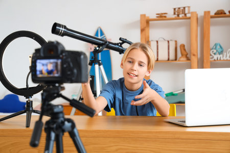 Teenage blogger recording video at homeの写真素材