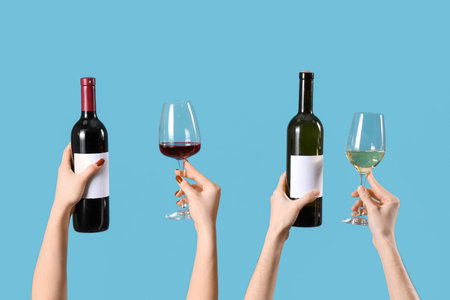 Women with bottles and glasses of wine on blue background. Valentine's Day celebration
