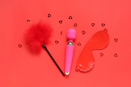 Composition with sex toys and sequins on color background. Valentine's Day celebrationの写真素材
