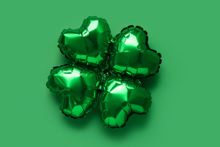 Balloon in shape of clover on green background. St. Patrick's Day celebrationの写真素材