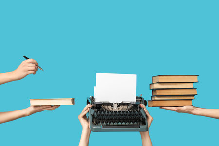 Women with vintage typewriter and books on blue background