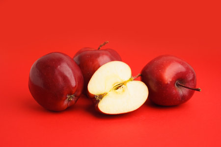 Fresh red apples on color backgroundの写真素材