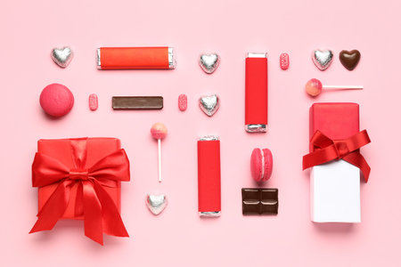 Different tasty sweets and gift boxes on pink background. Valentine's Day celebration