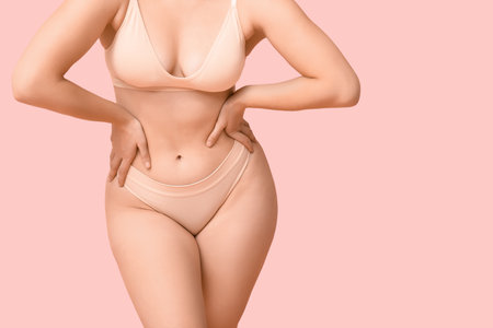 Body positive woman in underwear on pink background, closeupの写真素材