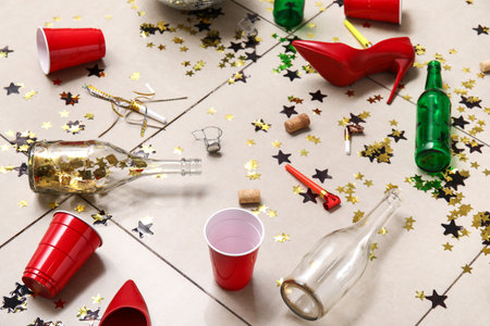 Mess with confetti on tile floor after party, closeupの写真素材