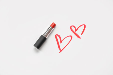 Red lipstick with drawn hearts on white background. Valentine's day celebrationの写真素材