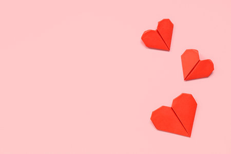 Red hearts on pink background. Valentine's day celebrationの写真素材