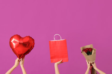 Women with balloon, shopping bag and roses on purple background. Valentine's Day celebrationの写真素材