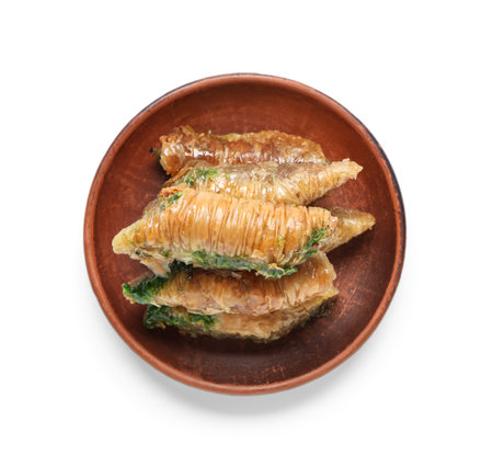 Plate with tasty Eastern sweets for Ramadan on white backgroundの写真素材