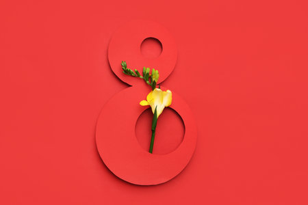 Figure 8 made of paper and beautiful flower on red background. International Women's Dayの写真素材