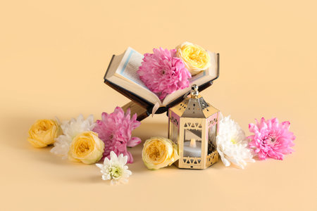 Muslim lamp with flowers and Koran on beige background. Ramadan celebration