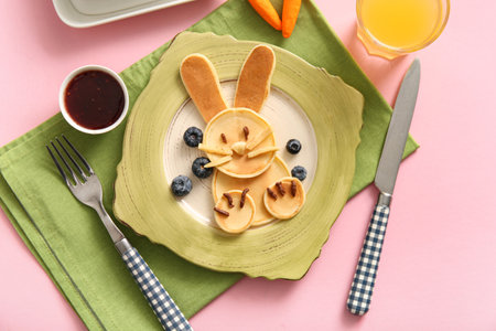 Funny Easter bunny pancakes with blueberry on pink backgroundの写真素材
