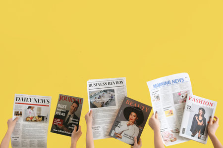 Women with newspapers and magazines on yellow background