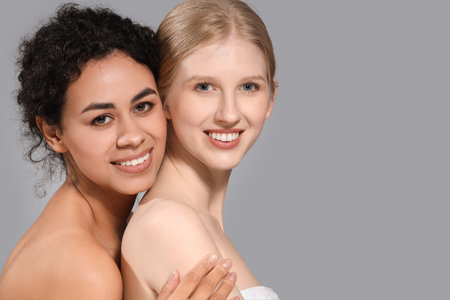 Beautiful women on gray background, closeupの写真素材