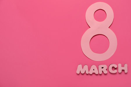 Date 8 MARCH made of paper on pink background. International Women's Dayの写真素材