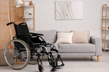 Modern wheelchair in interior of living roomの写真素材