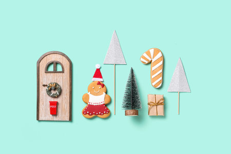 Beautiful composition with gingerbread cookies, Christmas fir tree and different decorations on...