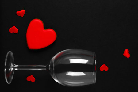 Frame made of glass and hearts on black background. Valentine's Day celebrationの写真素材