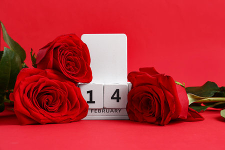 Calendar with date of Valentines Day and roses on red background