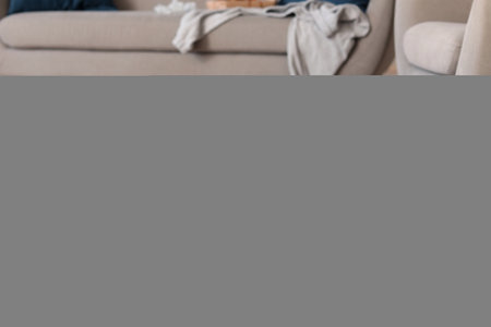 Naughty Staffordshire Terrier with Christmas branches and torn pillow on pet bed at homeの写真素材