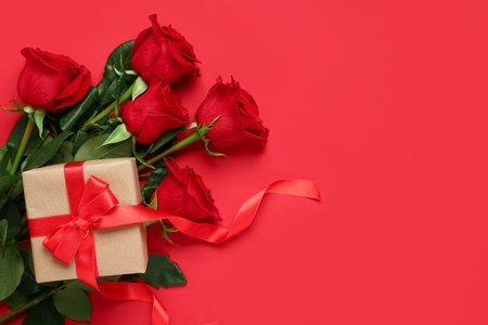 Roses with gift box on red background. Valentine's day conceptの写真素材