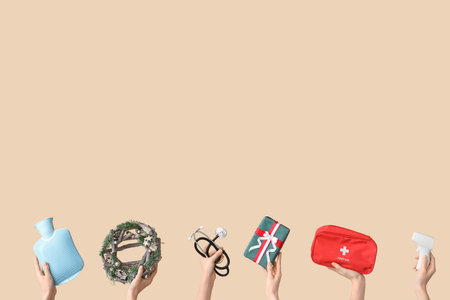 Hands holding medical equipment and Christmas decorations on beige backgroundの写真素材