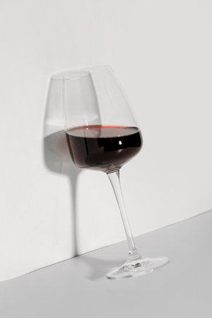 Glass of red wine on white backgroundの写真素材